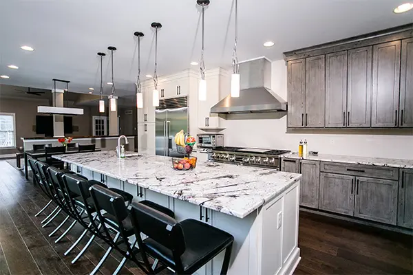 A kitchen with a large island and lots of counter space.