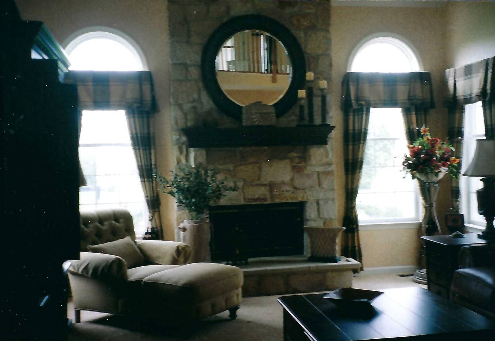 A living room with a fireplace and a couch